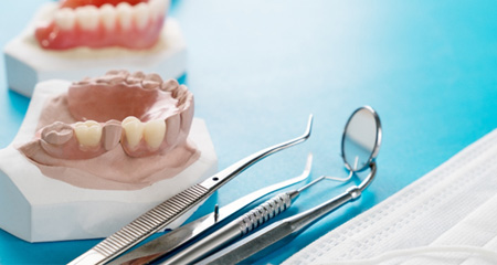 different types of dentures on plaster molds of mouths