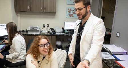 Patients being greeted by front desk clerk