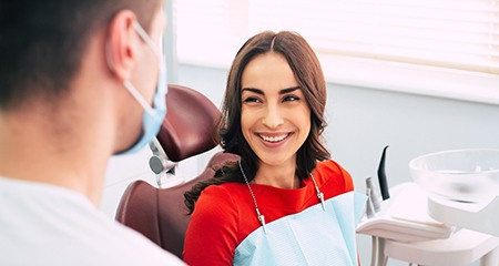 Patient smiling at dentist during dental checkup